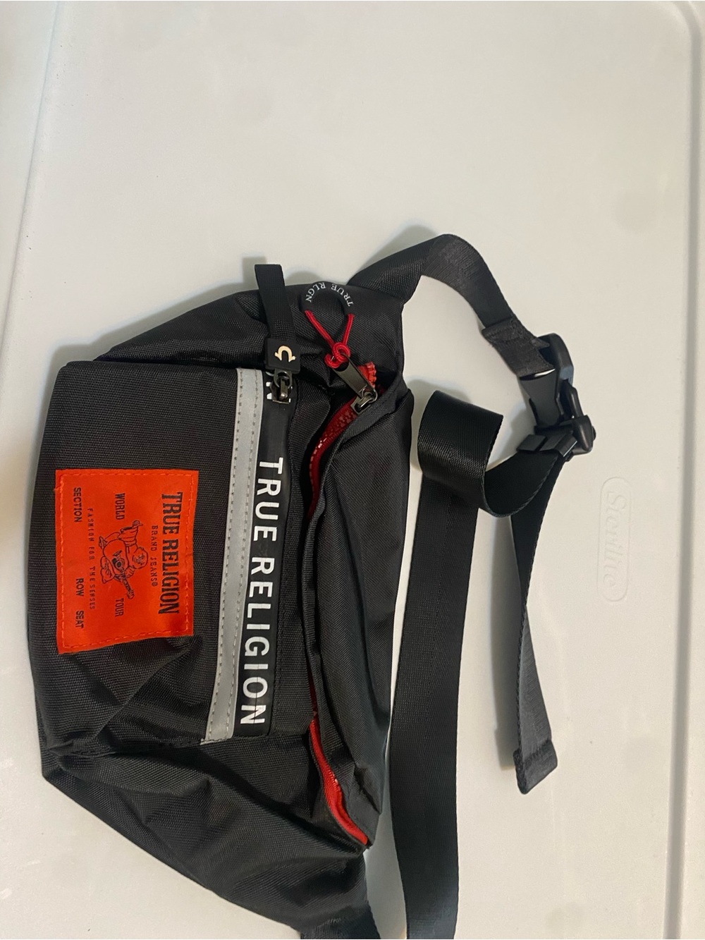 True Religion Black Belt Bag with Red and Orange Accents